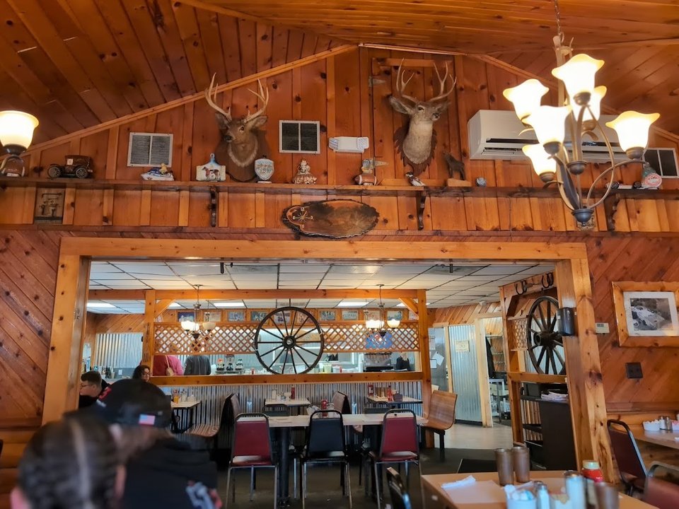 Comfortable restaurant space with classic booths.